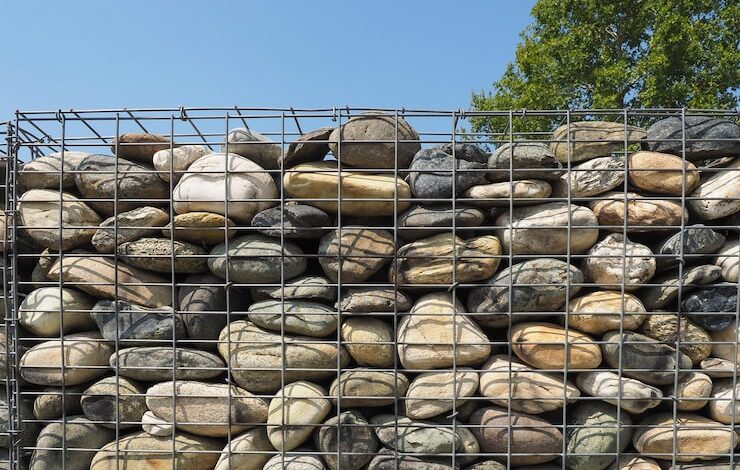 Gabion retaining wall installed for large scale infrastructure and erosion control project