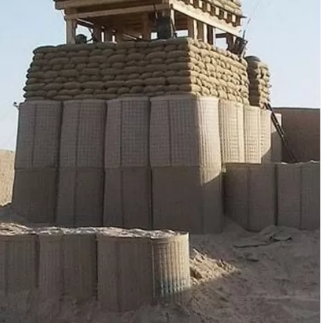 Sand-filled military defense barriers from a military barrier supplier in UAE forming a guard post wall